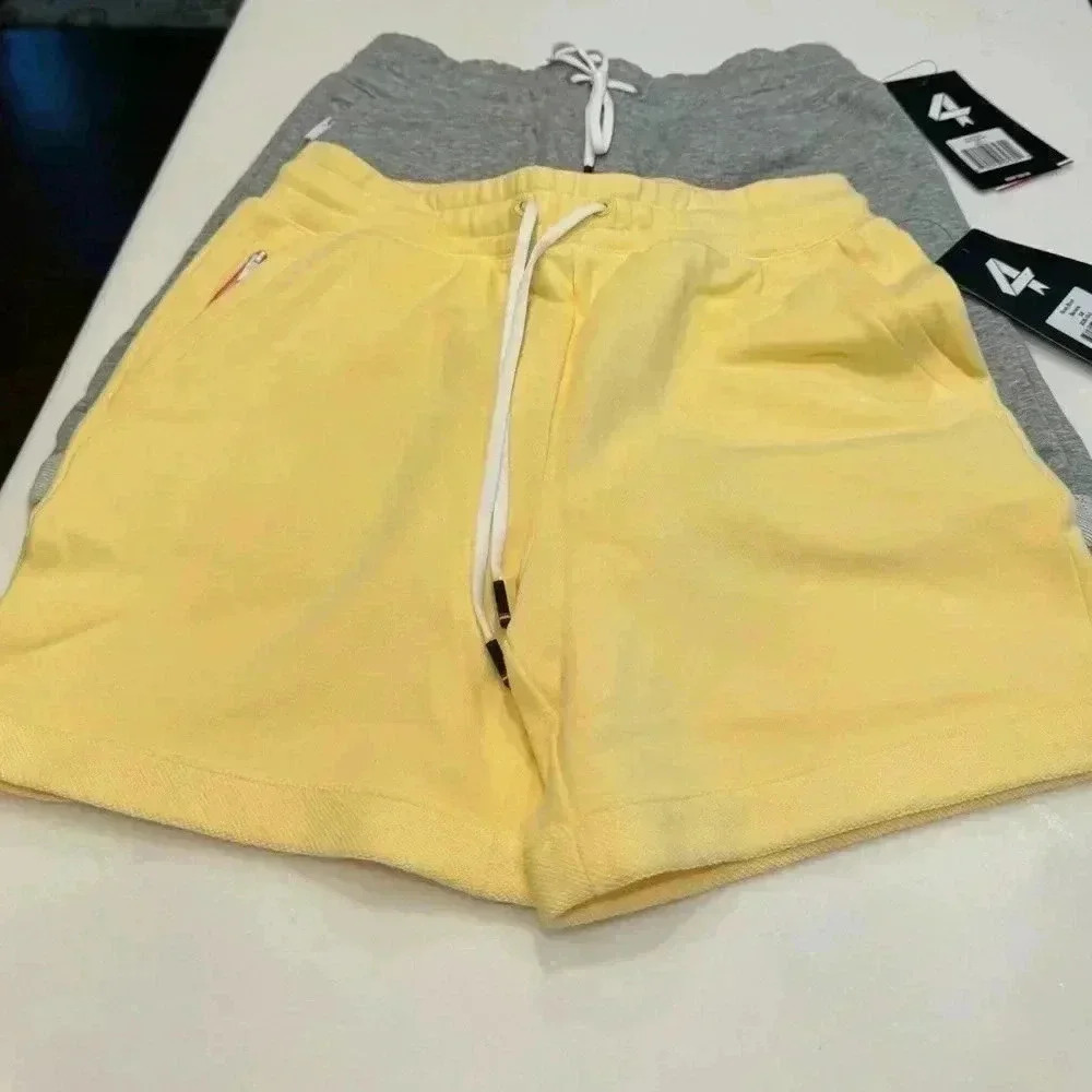 (2) Fourlaps rush athletic shorts. 1-yellow 1-gray. Size XS NWT